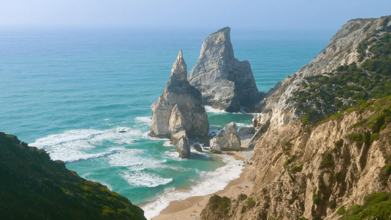 Wild and untouched Praia da Ursa near Cabo da Roca with unique rock formations and ocean views