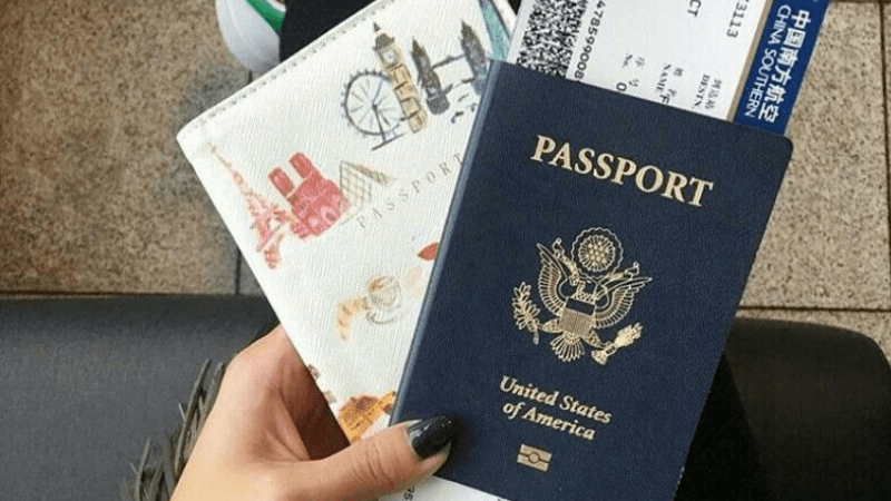 Close-up of a passport with other tickets related to travel.